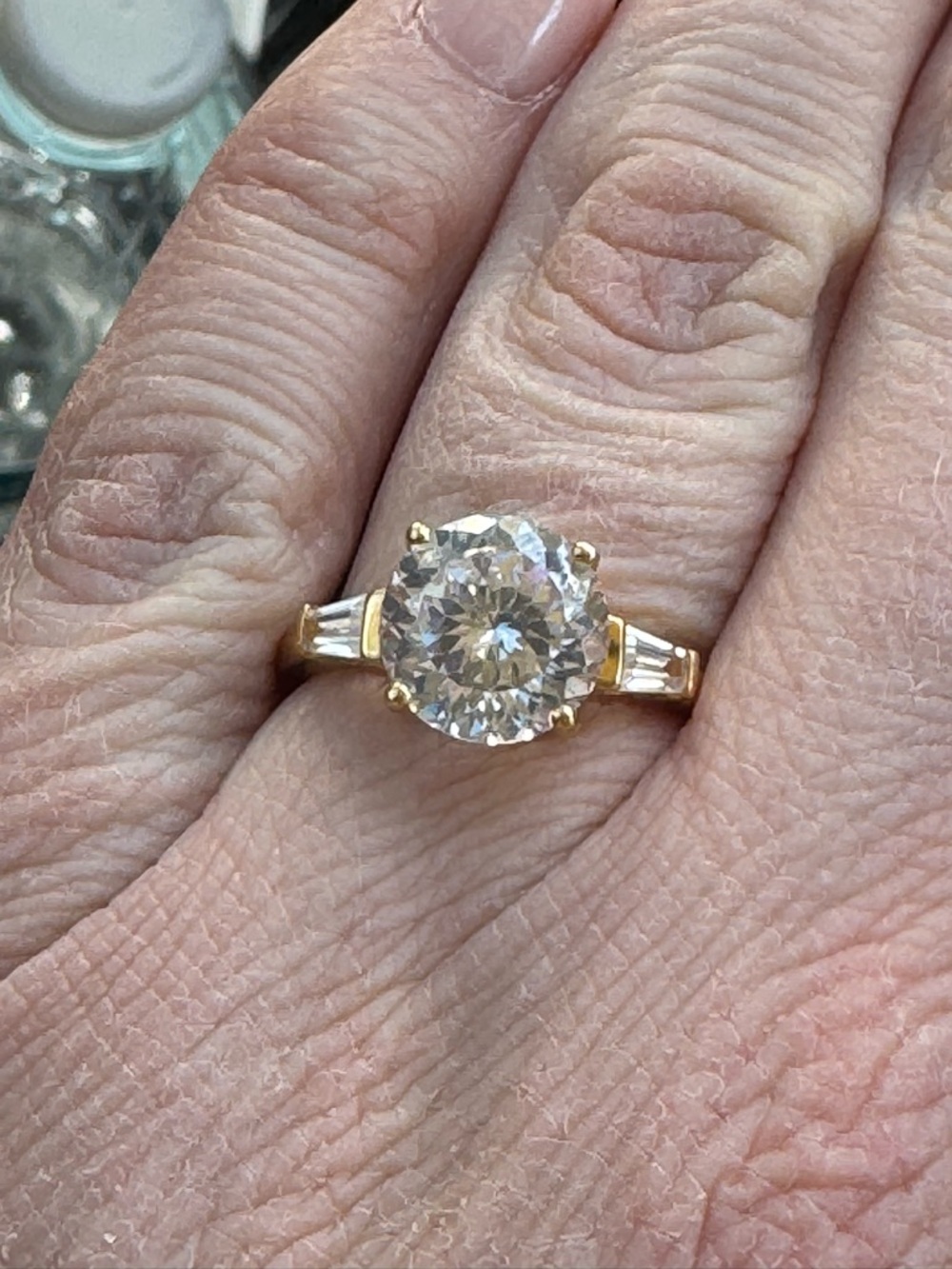 Statement Solitaire ring gold toned CZ baguette sides engagement style ring